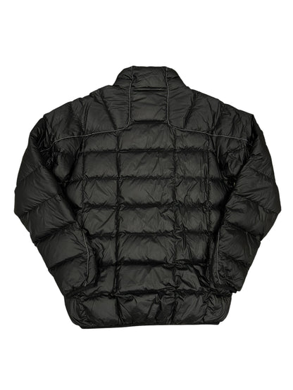 Chaqueta acolchada negra And Wander técnica ligera