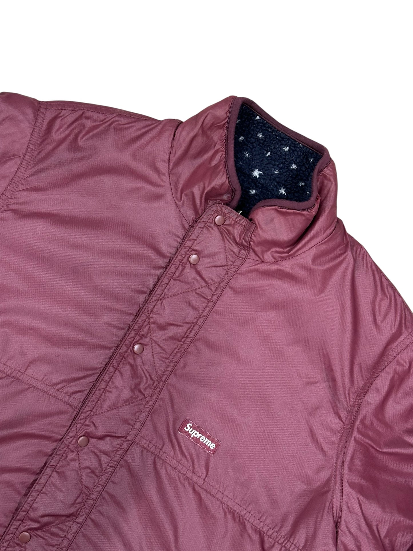 Chaqueta Supreme reversible acolchada granate / forro sherpa azul marino